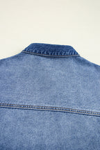 Blue denim jacket on a light beige background