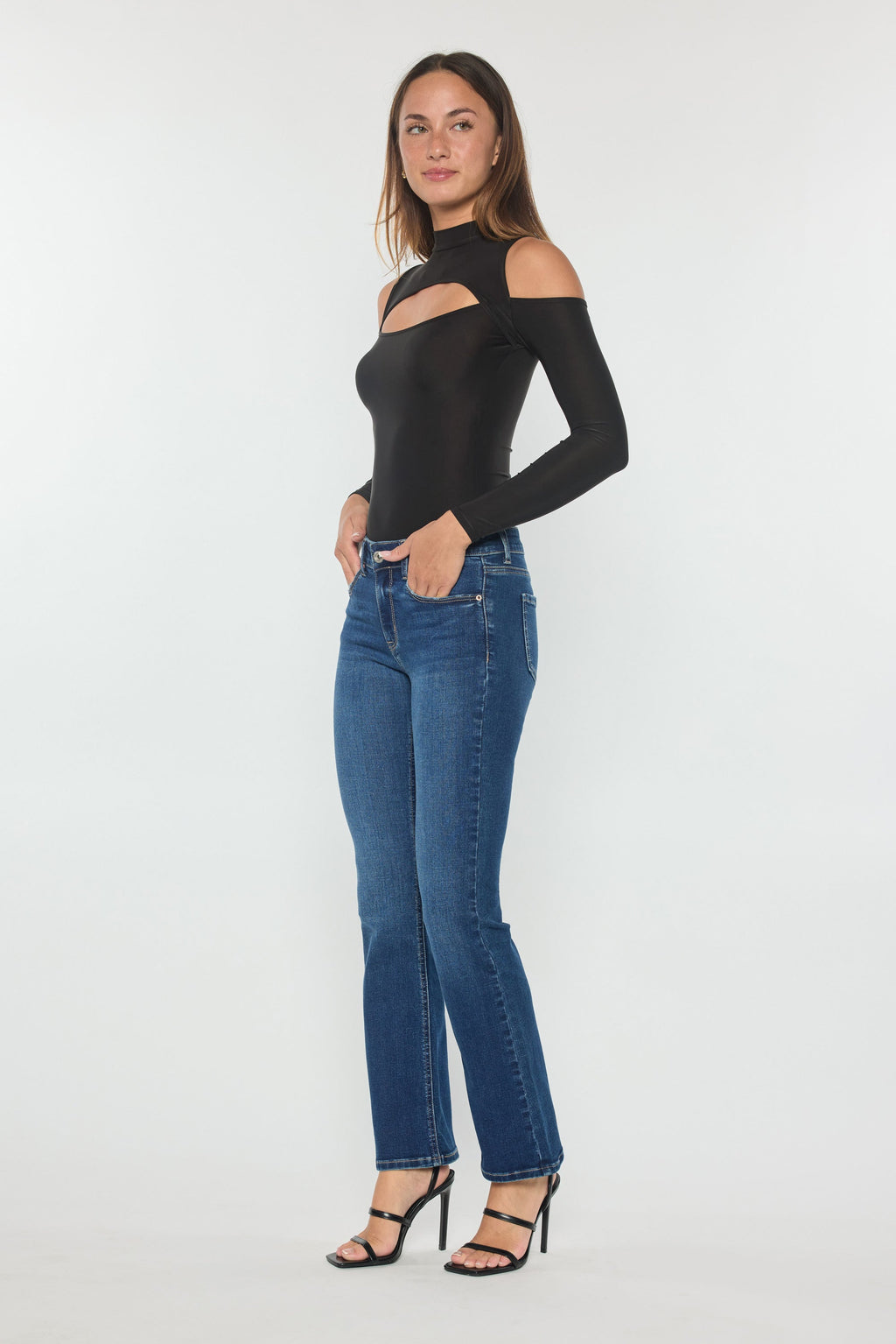 Women's blue bootcut jeans, perfect for pairing with boots