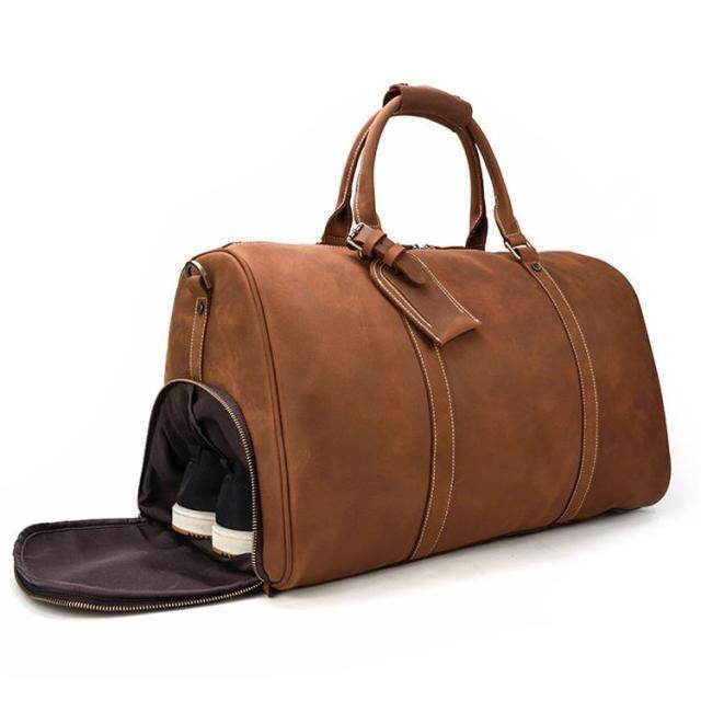 Large leather travel bag with a spacious main compartment and shoe pocket for comfortable travel