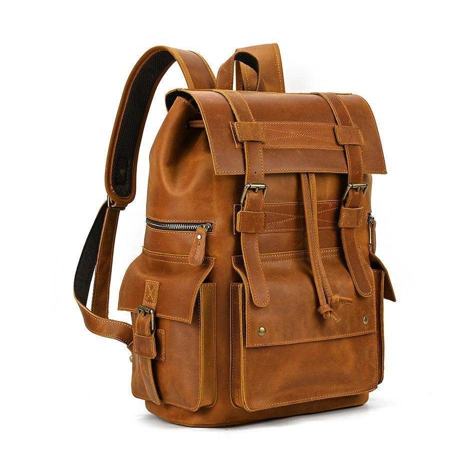 Mens brown leather backpack with multiple pockets and adjustable straps for stylish and practical use