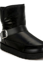 Black ankle boots with a silver buckle strap, perfect for stylish women's footwear