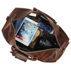 Vintage leather travel duffle spacious interior with tablet camera and clothing stored inside