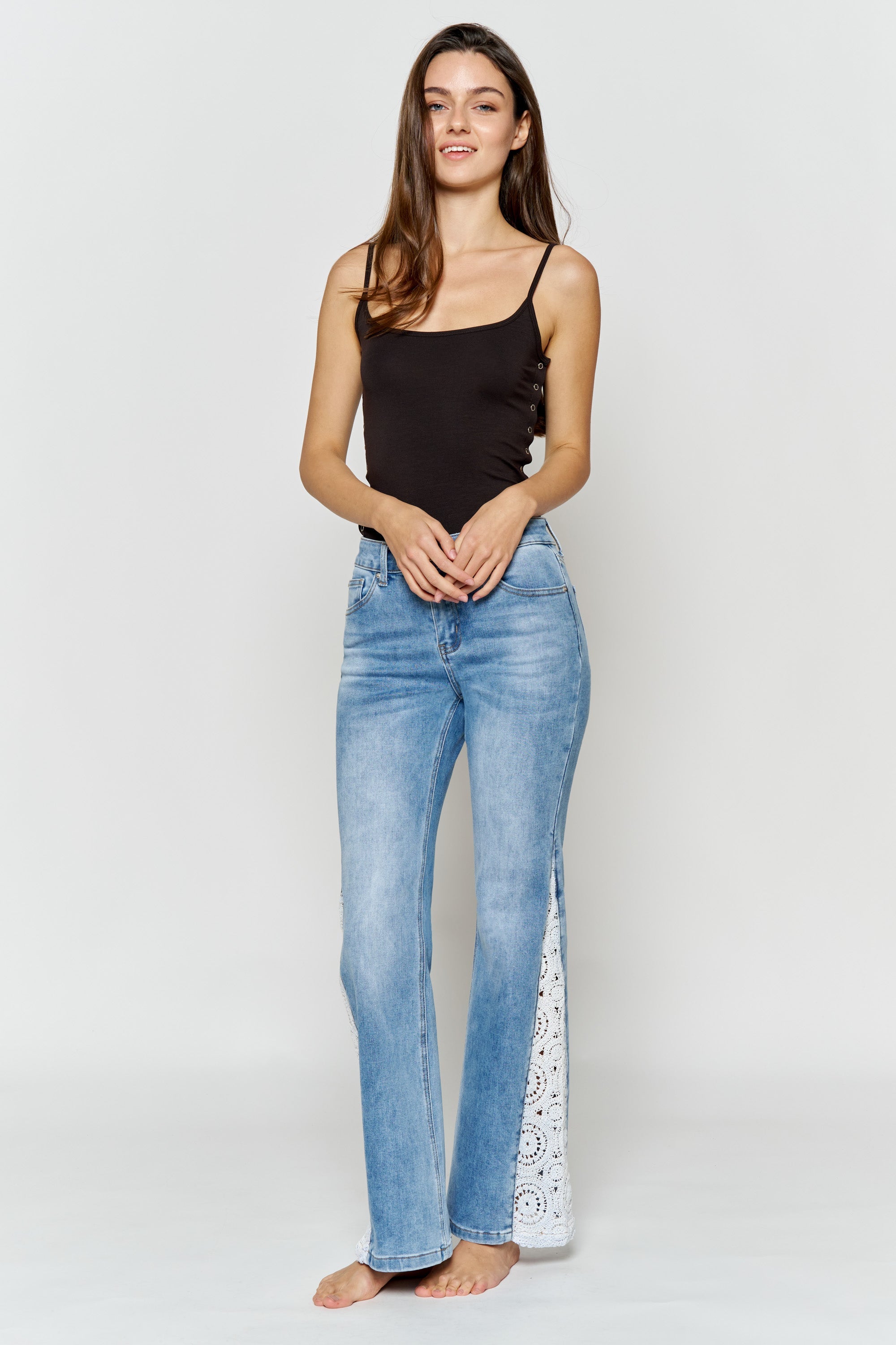 Women's blue wide-leg jeans with lace detail, stylish for casual outings