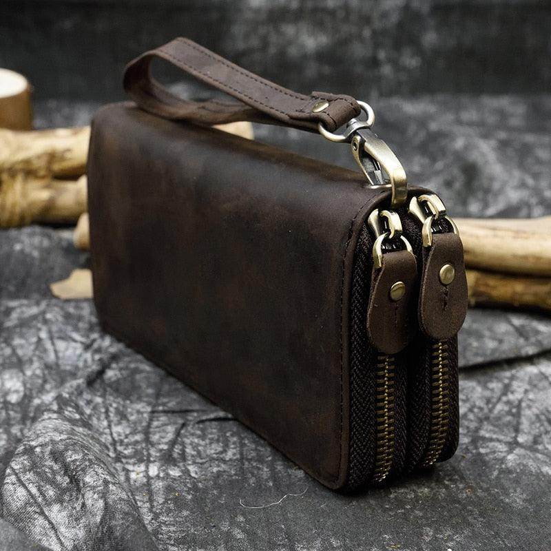 Vintage-style crazy horse leather wallet with double zipper and wrist strap for travel convenience